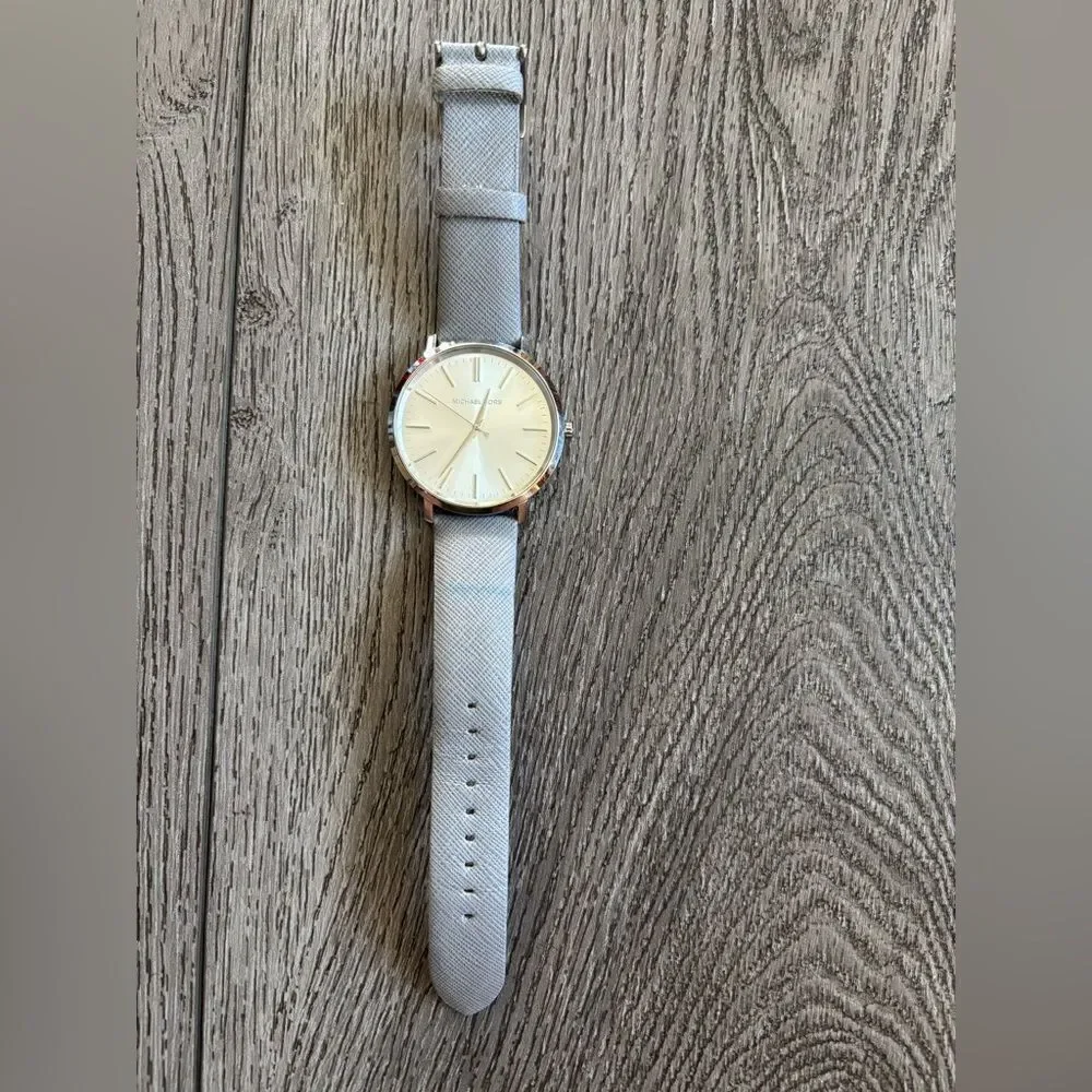 Michael Kors woman’s Elegant Silver Watch used in good condition